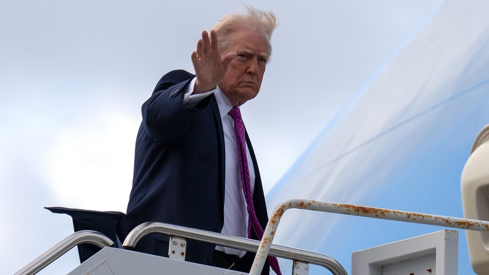 Airport cleared to be renamed for Trump as he unveils design for skyscraper library