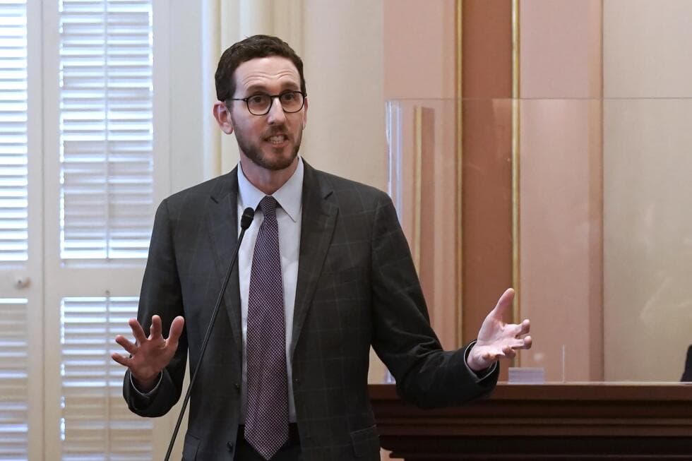 Image altered to change title on book held by California state senator - AP News