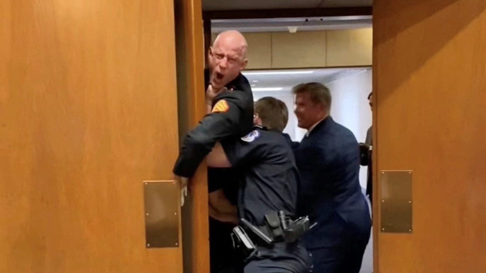 Senator, police remove Marine veteran protesting Iran war from hearing