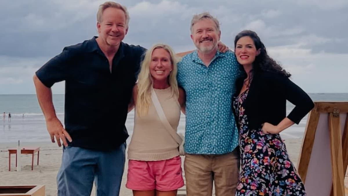 Thomas Massie joins forces with Marjorie Taylor Greene for anti-MAGA vacation snap just days after being ousted from Congress by Trump