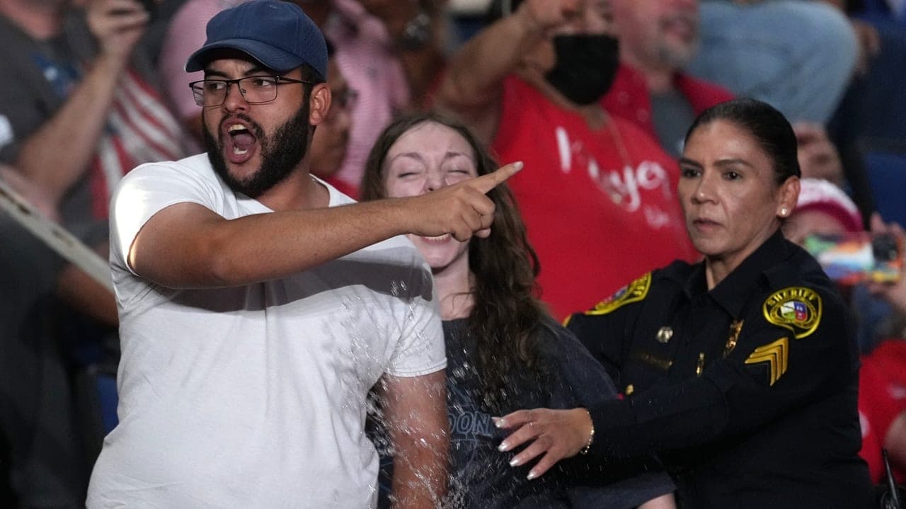 Trump interrupted by protesters as he fights to rally Texas voters behind Paxton in US Senate race