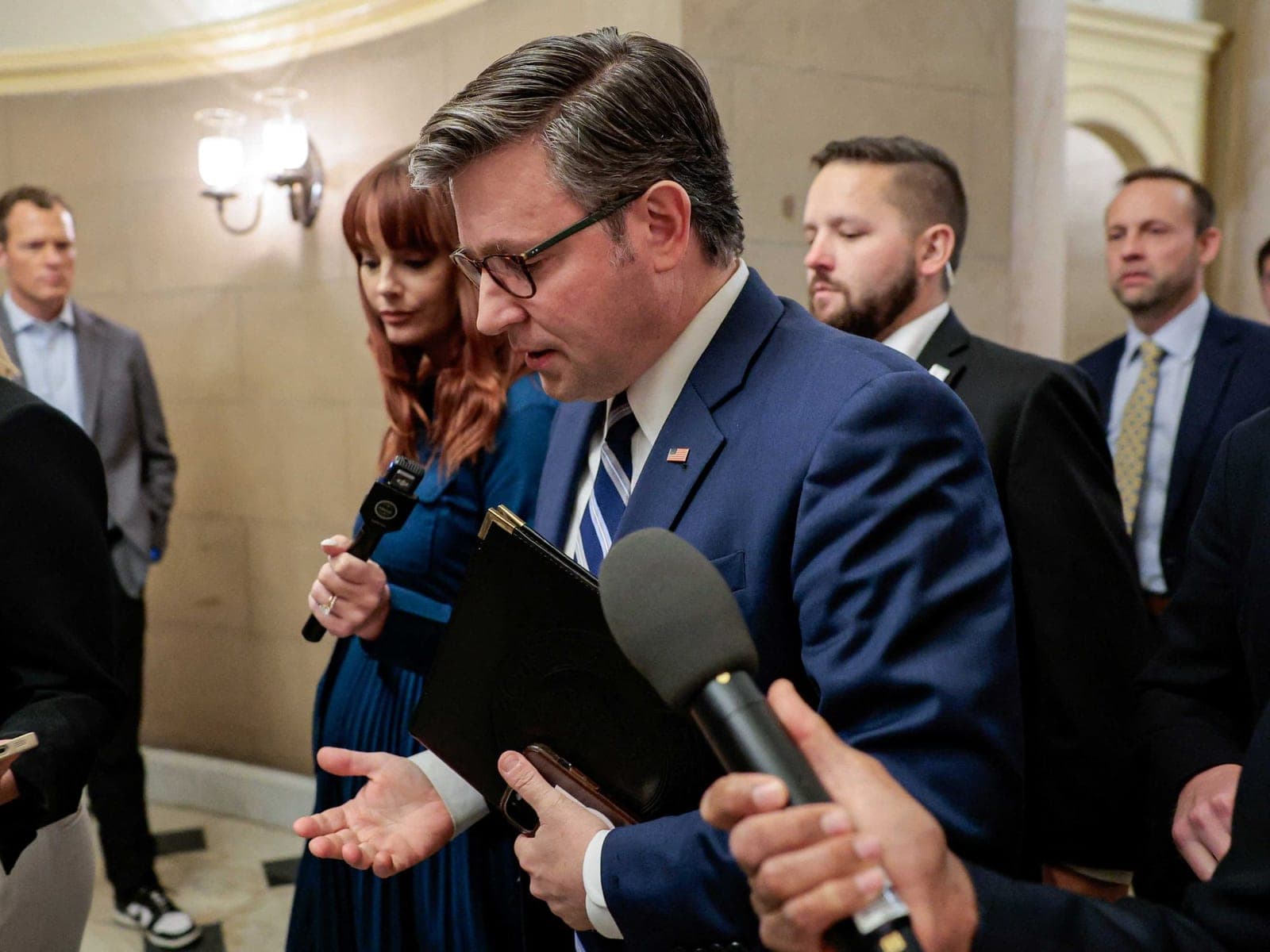 Mike Johnson bolts down Capitol steps when pressed on Trump's latest threat