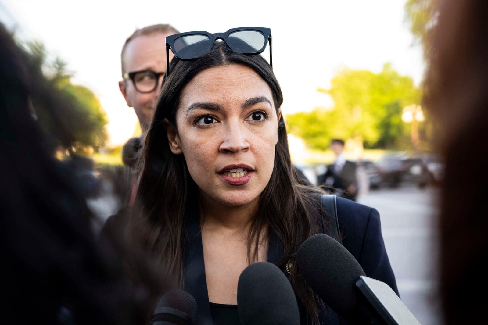 AOC Says Mike Johnson's GOP Is "Running a Protection Racket" for Trump