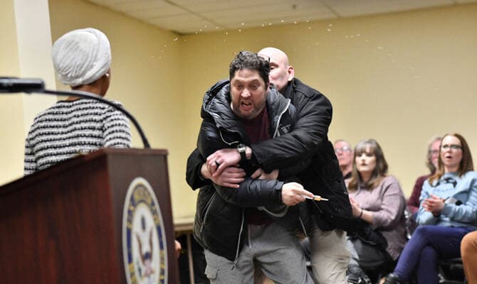 Man tackled to ground after spraying unknown substance on Rep. Ilhan Omar at Minneapolis town hall